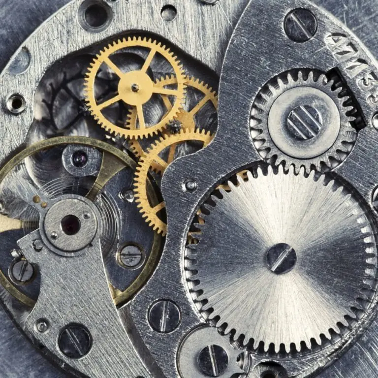 Close-up of a mechanical watch movement with gold-colored gears
